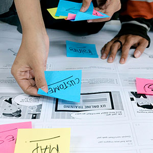 Diverse team collaborating in a modern Asian office (Collaboration)